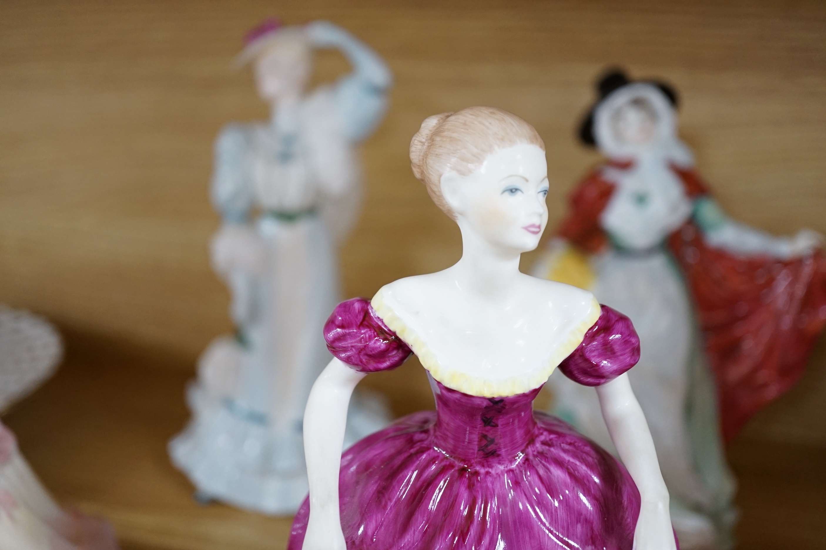 Seven Royal Doulton figurines and three Coalport figurines